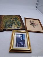 Three framed pictures laid out together