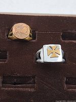 Front view of both rings showing buffalo nickel design and Maltese cross