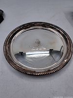 Full frontal view of the silver-plated tray showing overall form and rim detailing