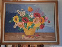 Full view of framed cross-stitch still life artwork