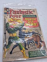 Front cover in plastic sleeve showing title, issue number 32, 12¢ price