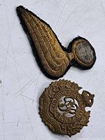 Front view of bullion wing patch and Canadian cap badge