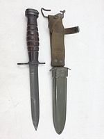 Full view bayonet alongside scabbard