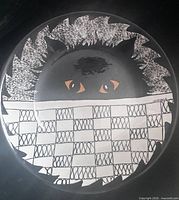 Front of bowl showing cat design and checkered pattern