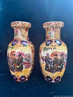 Front view of both vases showing main painted scenes and overall form
