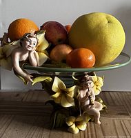 Full view of centerpiece with fruit for scale