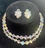 Necklace on bust with earrings displayed