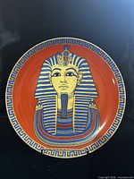 Front of plate showing King Tut mask design