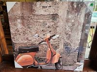 Front view of moped canvas print in plastic wrap