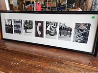 Full view of framed collage spelling WELCOME