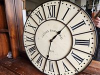 Front view showing Louis Barnard branding, Roman numerals, hands, overall design