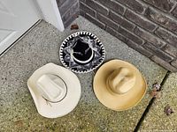 Three hats on ground showing overall lot