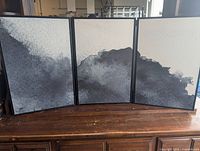 Front view of all three framed prints arranged together