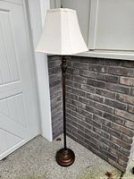 Full view of floor lamp with shade