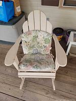 Single Adirondack rocker glider with floral cushions