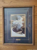 Framed Season of the Eagle print in oak frame