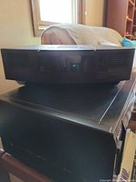 Front view of Bose Wave Radio/CD showing speaker grille and display