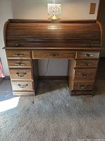 Front view of closed roll-top desk showing overall design and finish