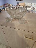 punch bowl, ladle, two cups overall view
