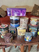 Group shot of all tins showing shapes, colours, brands