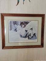 Full view of framed wolf print on wall