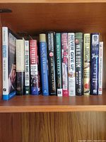 Shelf with 13 sports hardcovers