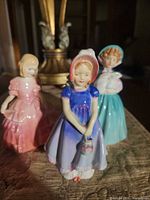 Three figurines grouped together