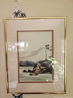 Mountain landscape print in gold-tone frame
