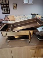 Chafing dish on stand with insert pan visible
