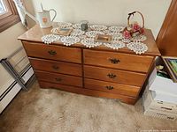 Front view of six-drawer dresser, showing finish and hardware