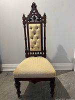 Full front view of carved Gothic Revival hall chair