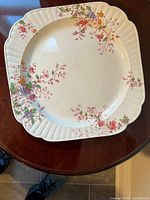 Top view of Booths Washington pattern platter showing floral design and shape