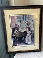 Front view of framed print showing artwork, matting, and frame