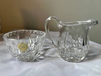 Front view of creamer and sugar bowl together