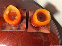 Top view of both candle holders with candles showing wax usage