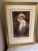 Full view of framed print showing image, mat and gold frame