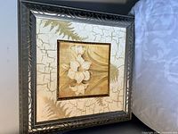 Front view of framed botanical artwork showing frame and full design
