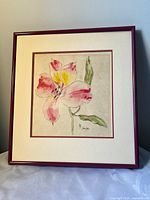 Front view showing blossom painting, matting and red frame