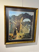 frontal view of framed classical ruins print showing image details and frame