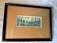 Front view of framed artwork showing image, mat and frame