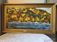 front view of framed oil painting showing artwork, frame and title plaque