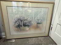 Front view of framed impasto floral painting