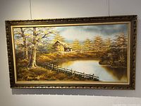 Full frontal view of framed landscape painting on wall
