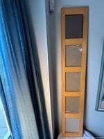 front view showing five openings and natural wood finish