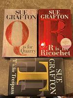 Front covers of the three hardcover books