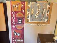 Full view of tapestry runner hanging beside another piece