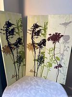 Front view of the three coordinating canvas panels with botanical prints