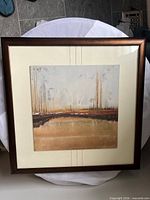 Front view of framed abstract landscape artwork