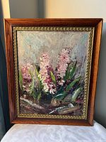 front view of framed floral impasto painting