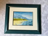 Front view of framed watercolor showing artwork, mat and frame